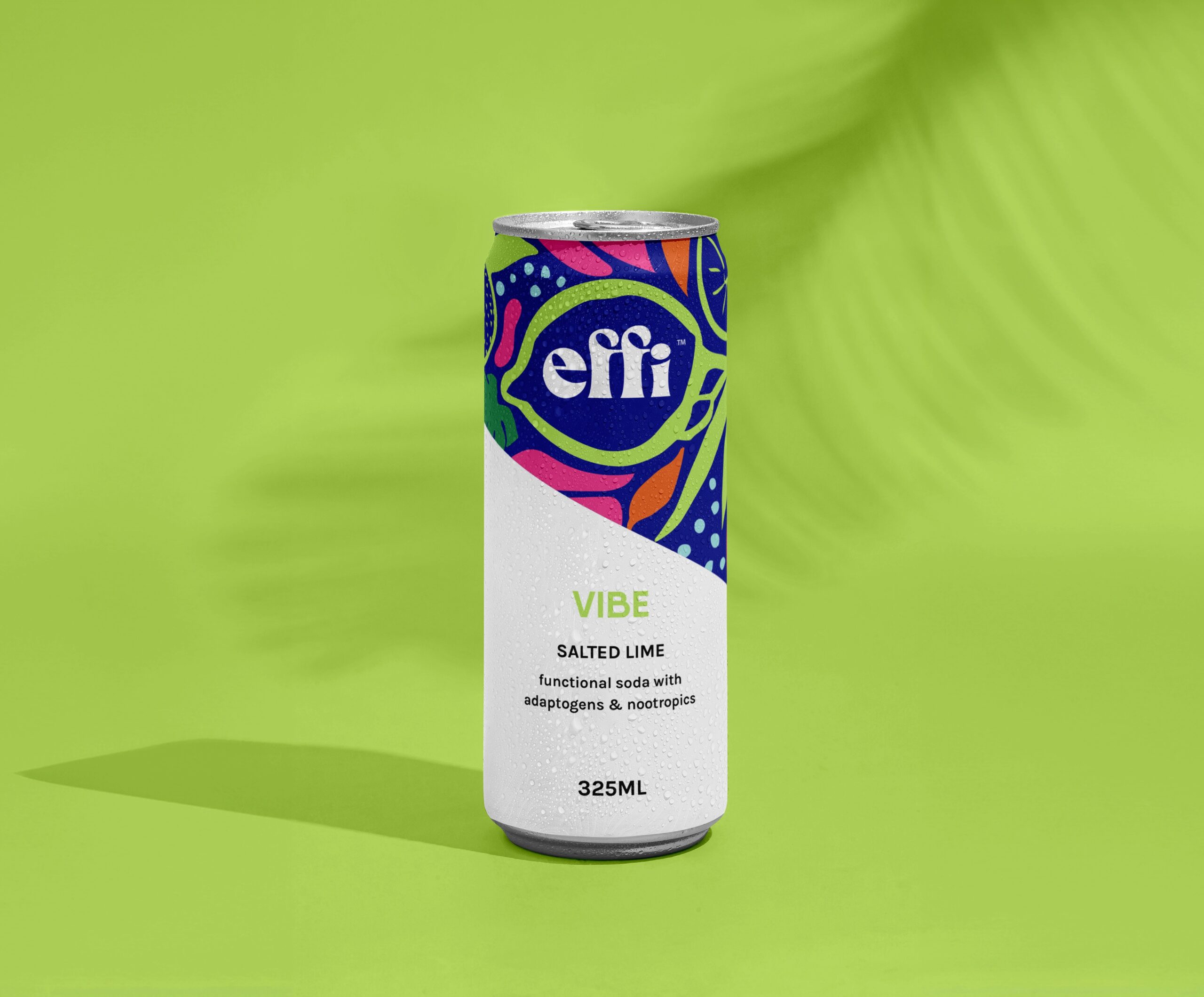 A can of effi VIBE functional soda on a lime-green background with a palm shadow in the background